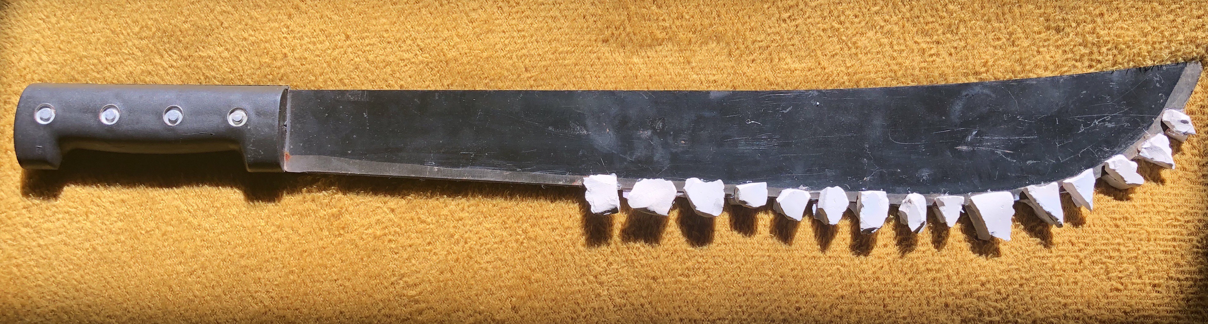 A Machete with teeth on the blade