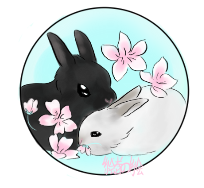 A black bunny and a white bunny sit together in flowers